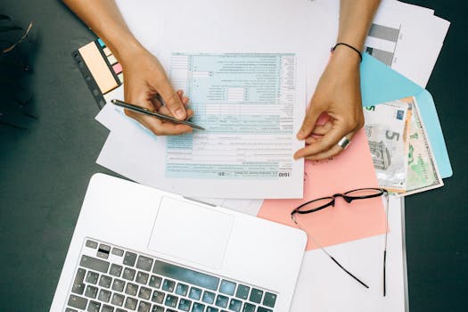 a person writing down financial goals